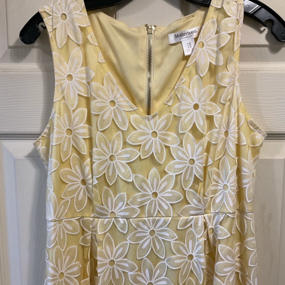 Motherhood Maternity Floral Dress. Pastel yellow with white lace detail.